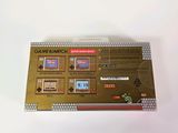 the back of a nintendo game console sitting on top of a white table