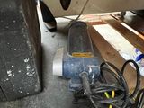 an image of a car being worked on by a mechanic