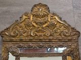 a mirror that is sitting on the wall in the room