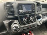 a car dashboard with a radio and a remote control