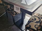 a table with a chair and a table with a number on it