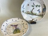 two plates with designs on them are sitting on a table