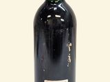 a bottle of wine that is sitting on a table