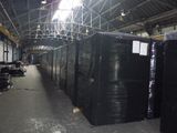 many black boxes in a warehouse with a lot of them