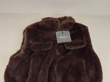 the fur is brown in color and has a tag on it