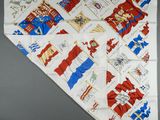a white banda with red and blue designs on it