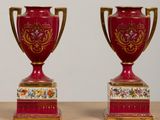 two vases that are sitting on a table