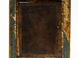 an old wooden picture frame with a brown and green paint on it