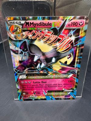 a close up of a box of pokemon cards on a table
