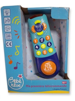 télécommande jouet bleue et orange dans une boîte ornée de notes de musique