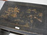 a black table with a black and gold design on it