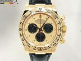 Montre Rolex en or jaune avec cadran noir et bracelet en cuir noir