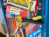 a blue box filled with books and other items