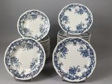 six blue and white plates stacked on top of each other