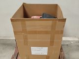 a cardboard box sitting on a dolly in the middle of a room
