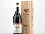 a bottle of wine sitting next to a wooden box