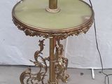 a table with a lamp on top of it in a room
