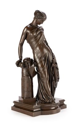 a bronze statue of a woman with a dog on a pedestal