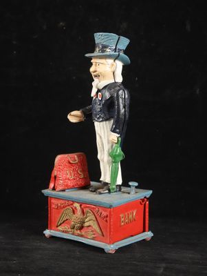 a statue of a man with a pipe and hat on top of a box