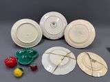 many plates that are sitting on a table