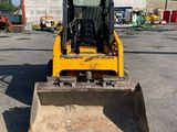 a picture of a yellow bulldozer parked in a parking lot