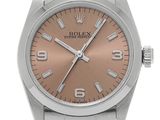 a close up of a watch on a white background with a brown dial