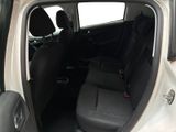 a small car with the door open and the seats down
