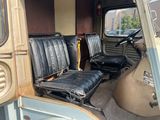 two seats in the back of a bus that is parked