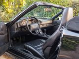 a car with the door open sitting in the driveway
