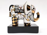 an elephant with a clock on it ' s back is standing on a black base
