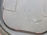 a close up view of a dirty trash can lid