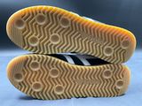 a close up of a pair of black and white shoes