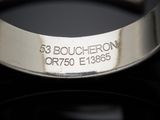 a close up of a silver bracelet with a name on it