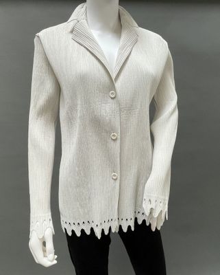 an image of a mannequin wearing a white sweater and black leggings
