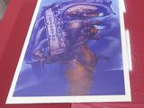 a picture of a poster on a table with a red table cloth