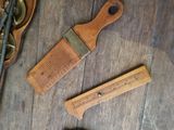 a wooden comb and a wooden ruler on a wooden table