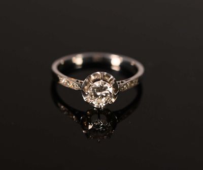 a white gold engagement ring with an old cut diamond