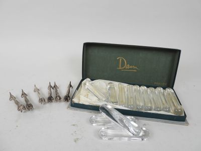 a box of silver spoons and a pair of scissors in it