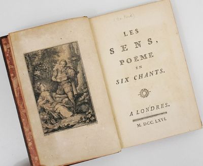 un vieux livre sur lequel figure l'image d'un homme et d'une femme dans un jardin