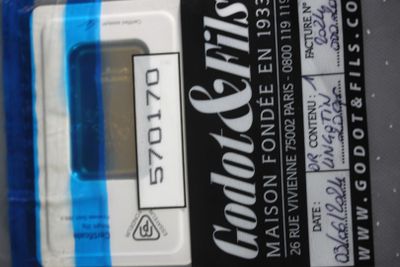 a close up of a blue and white electronic device on a table