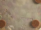 a close up of a clock on a table