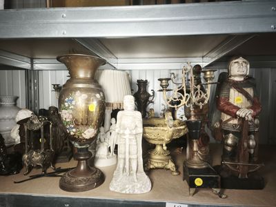 a shelf with a lot of antique items on it