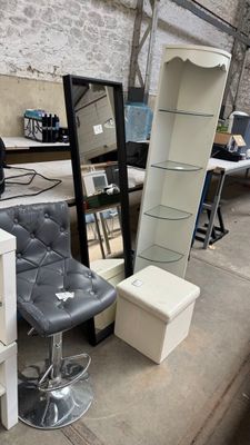 a lot of furniture that is sitting outside on the street