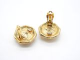 pair of gold plated earrings with a crown on top of them