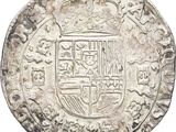 a close up of a silver coin with a coat of arms on it