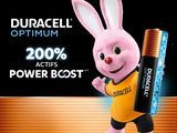 a rabbit that is holding a battery on a table