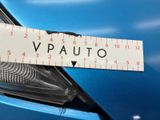 a sticker that says vp auto on the front of a blue car