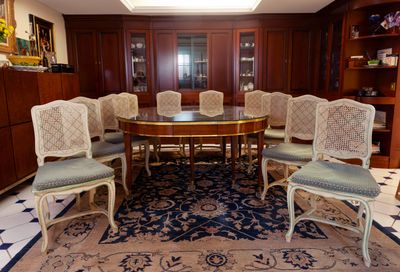 a dining room with a table and chairs in it