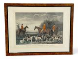 framed print of a group of men riding horses and dogs