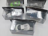 six plastic boxes with a toy car inside of them